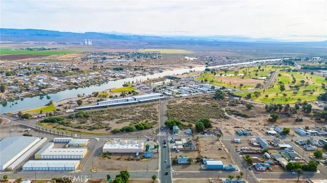 an aerial view of residential building and lake
