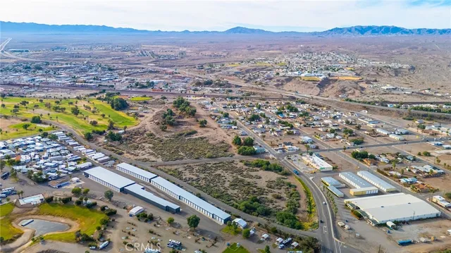 a view of a city with mountains in the background