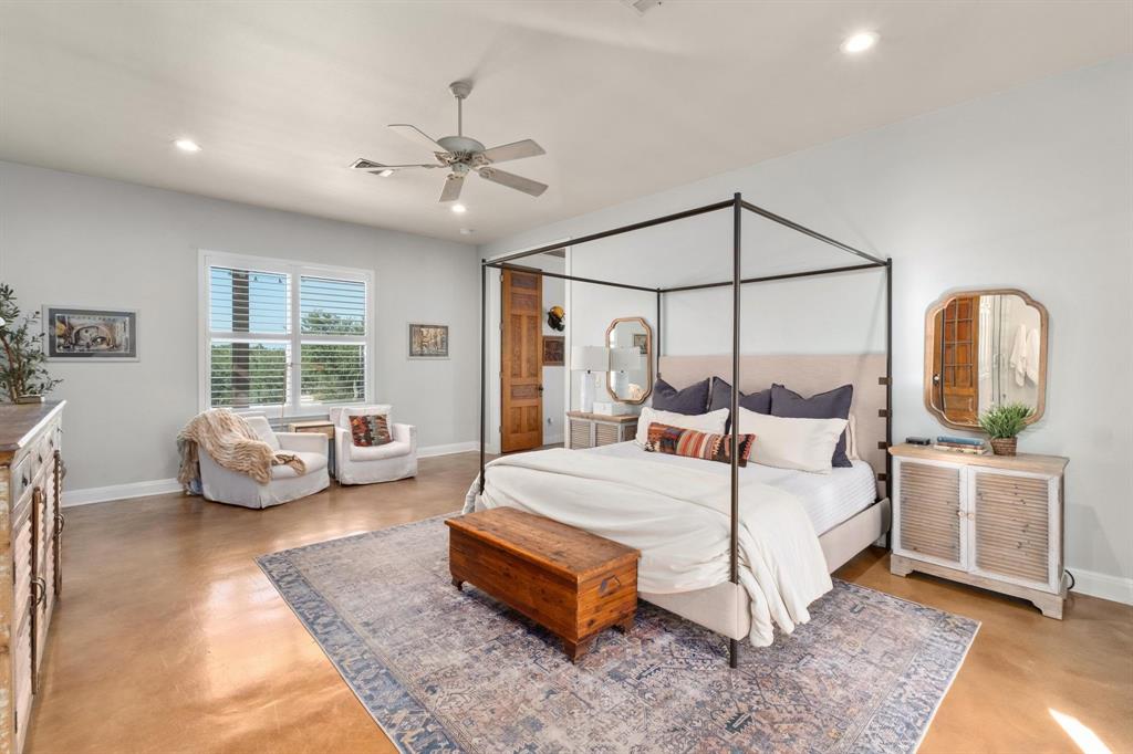 2300 West Fitzhugh Road Dripping Springs, TX 78620 - Photo 20 of 39 a bedroom with a bed and a couch