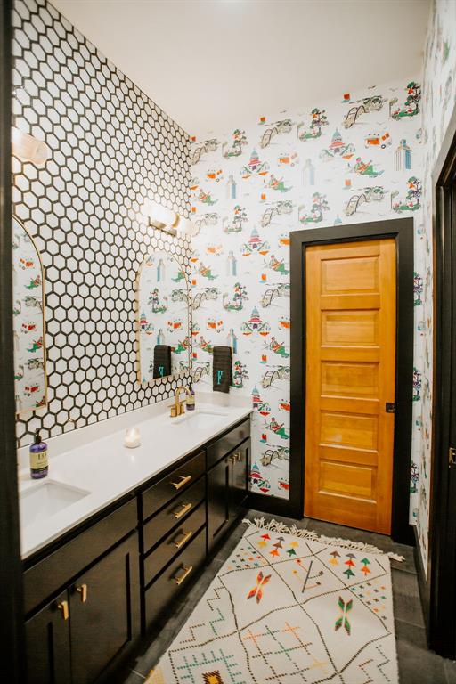2300 West Fitzhugh Road Dripping Springs, TX 78620 - Photo 28 of 39 a bathroom with a sink and a mirror