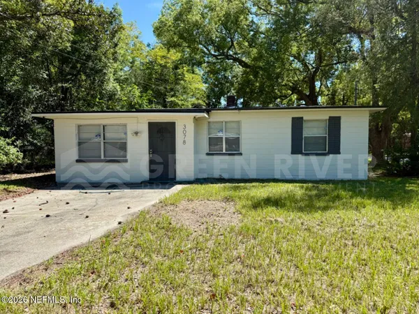 front view of a house with a yard