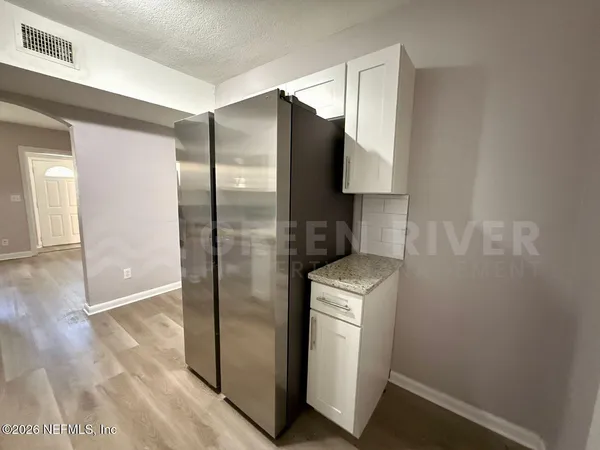 a view of an empty room with a window