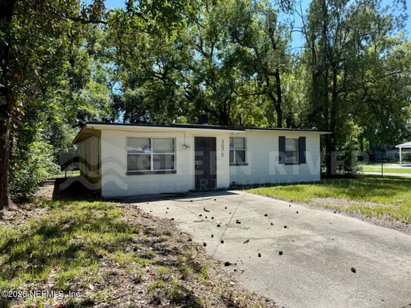 a house with trees in front of it