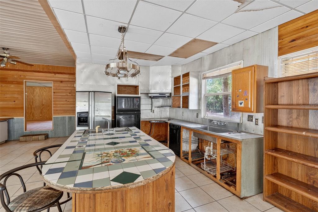 3749 Southwest 22nd Place Bell, FL 32619 - Photo 19 of 43 a very nice looking dining room with a large window and chandelier