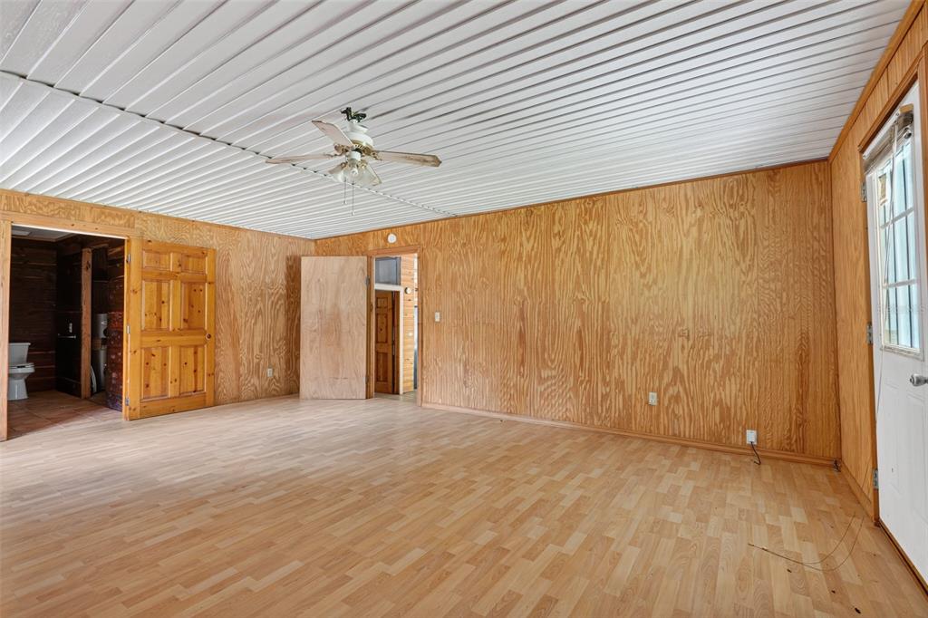 3749 Southwest 22nd Place Bell, FL 32619 - Photo 26 of 43 wooden floor in an empty room with a window