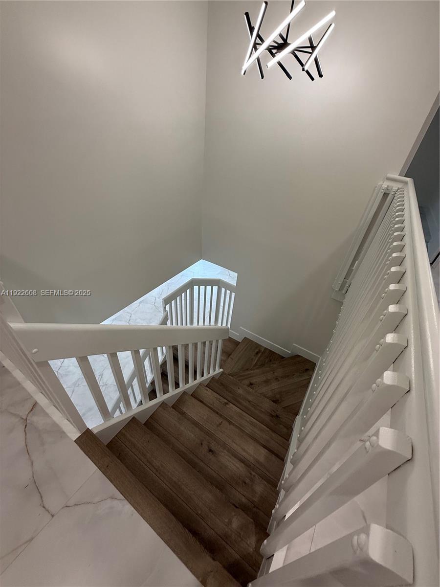 15254 Southwest 109th Street Miami, FL 33196 - Photo 12 of 48 a view of staircase with white walls