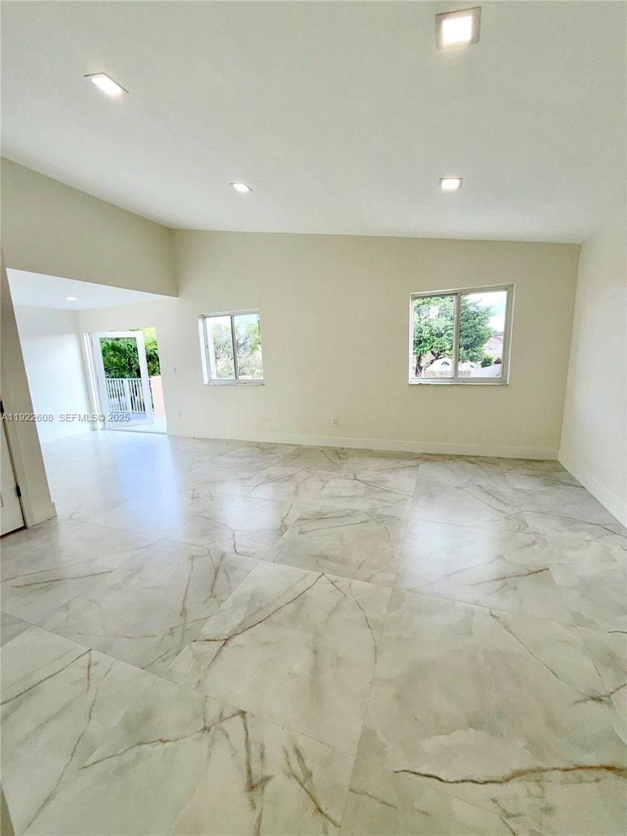 15254 Southwest 109th Street Miami, FL 33196 - Photo 14 of 48 an empty room with windows and closet