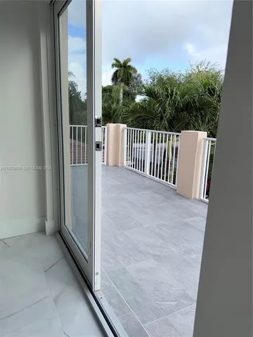 a view of balcony with furniture