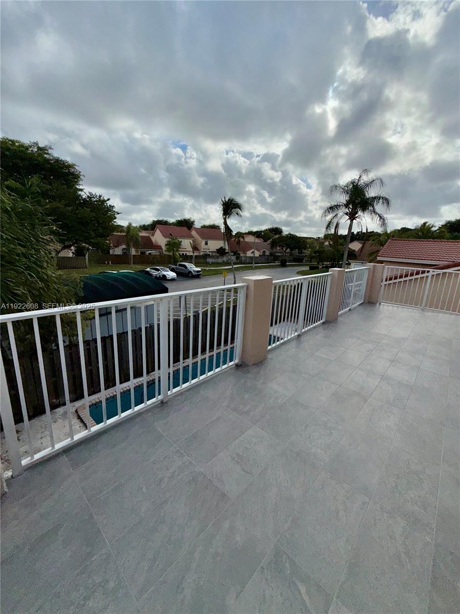15254 Southwest 109th Street Miami, FL 33196 - Photo 17 of 48 a view of balcony with furniture