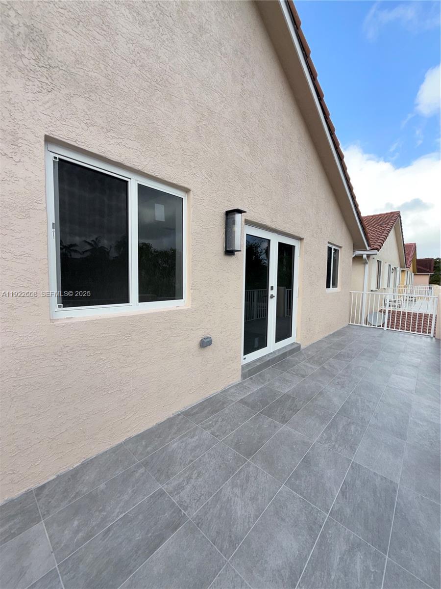 15254 Southwest 109th Street Miami, FL 33196 - Photo 18 of 48 a view of an empty room with a window