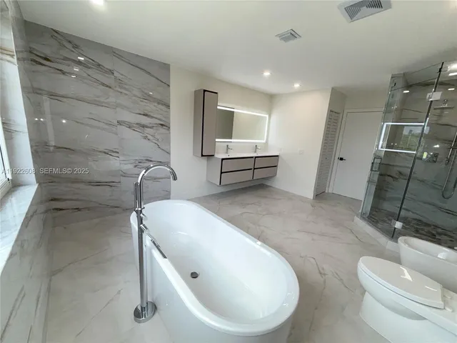 a view of a hallway with windows