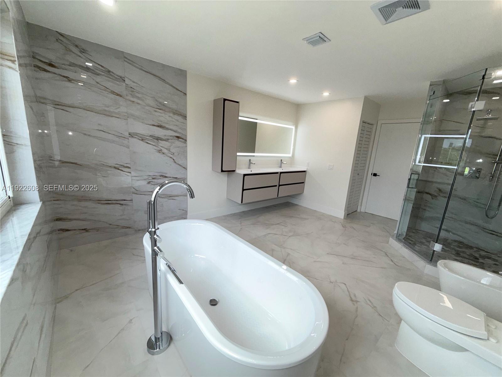 15254 Southwest 109th Street Miami, FL 33196 - Photo 23 of 48 a bathroom with a sink and mirror