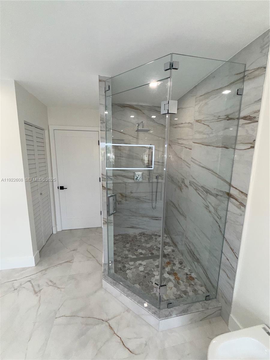 15254 Southwest 109th Street Miami, FL 33196 - Photo 24 of 48 a bathroom with a shower