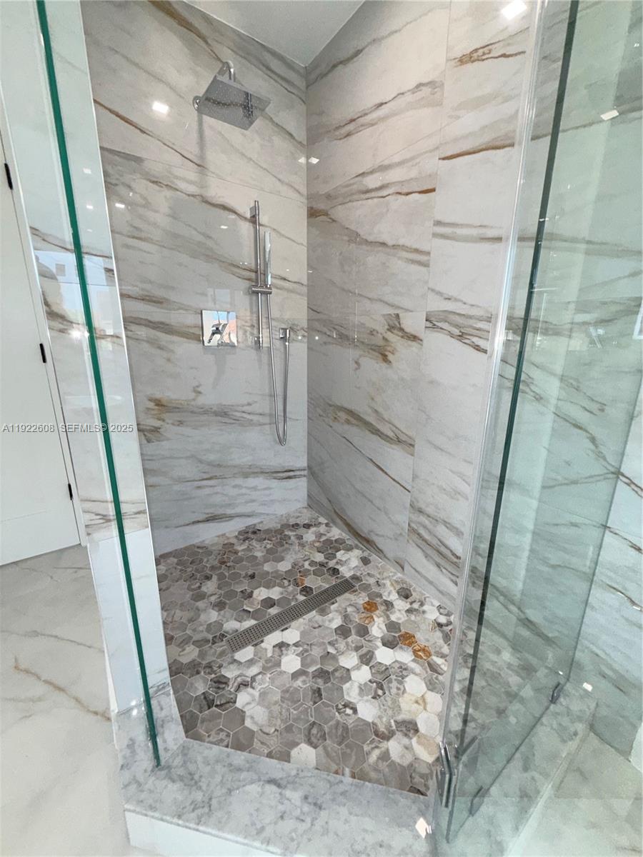 15254 Southwest 109th Street Miami, FL 33196 - Photo 25 of 48 a bathroom with a shower