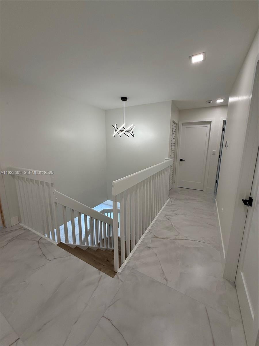 15254 Southwest 109th Street Miami, FL 33196 - Photo 26 of 48 a view of a hallway with windows