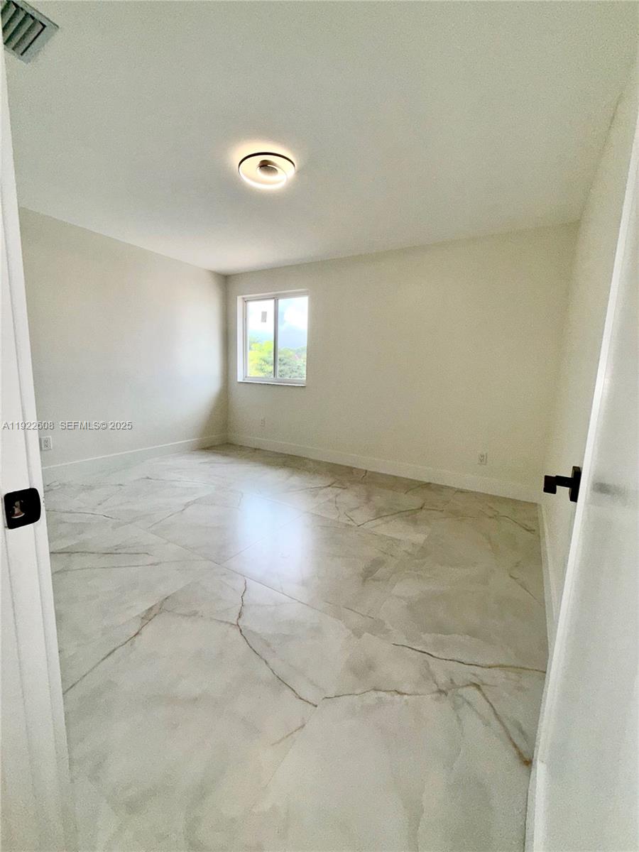 15254 Southwest 109th Street Miami, FL 33196 - Photo 27 of 48 an empty room with windows