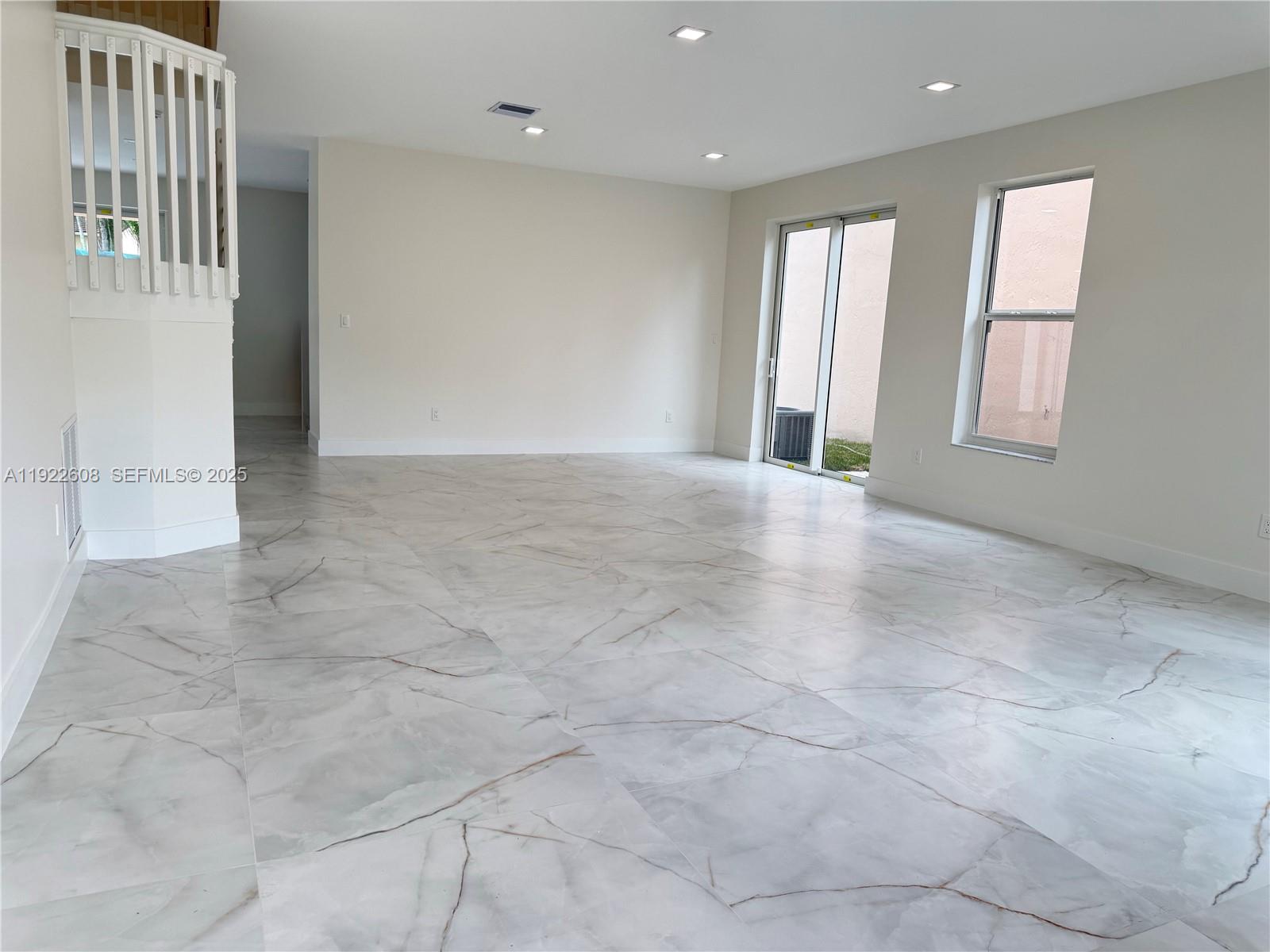 15254 Southwest 109th Street Miami, FL 33196 - Photo 3 of 48 a view of an empty room with a window