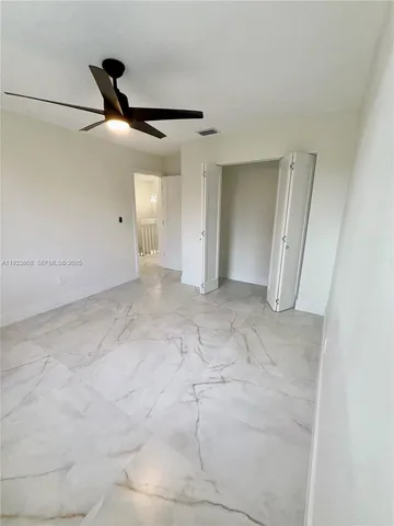 a view of a hallway with staircase