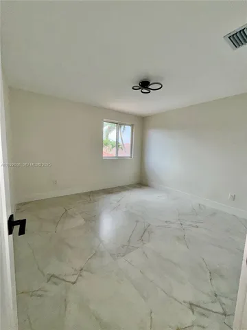 a bathroom with a toilet a sink and a mirror