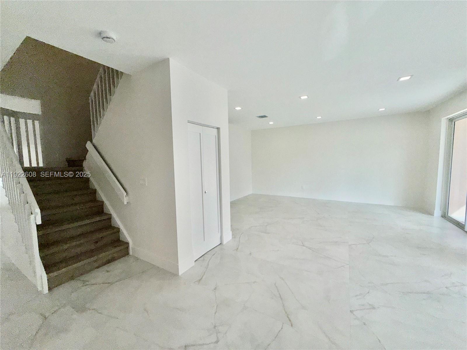 15254 Southwest 109th Street Miami, FL 33196 - Photo 40 of 48 a view of a hallway with staircase