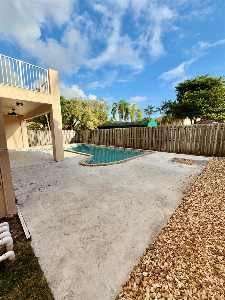 15254 Southwest 109th Street Miami, FL 33196 - Photo 45 of 48 a view of a yard with wooden fence