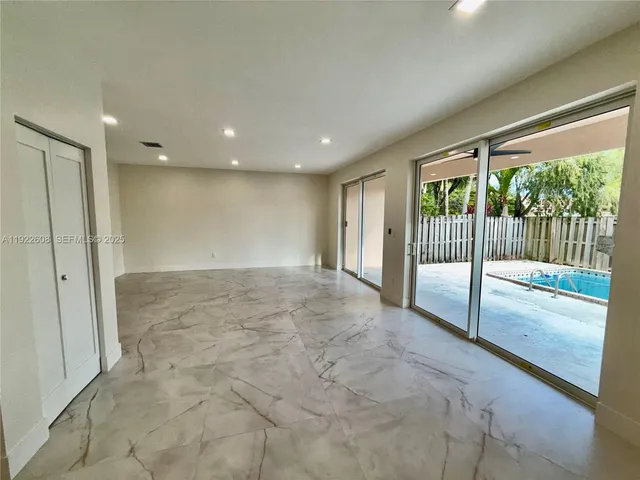 a large living room with a large bed and a couch