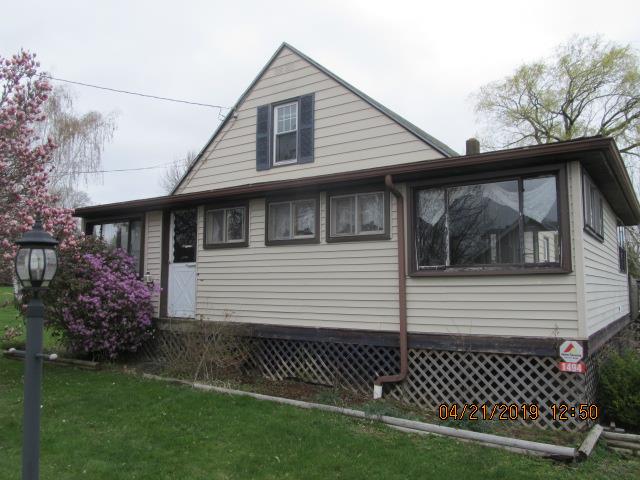 1494 Thompson Road Franklin, PA 16323 - Photo 1 of 21 a front view of a house with a garden