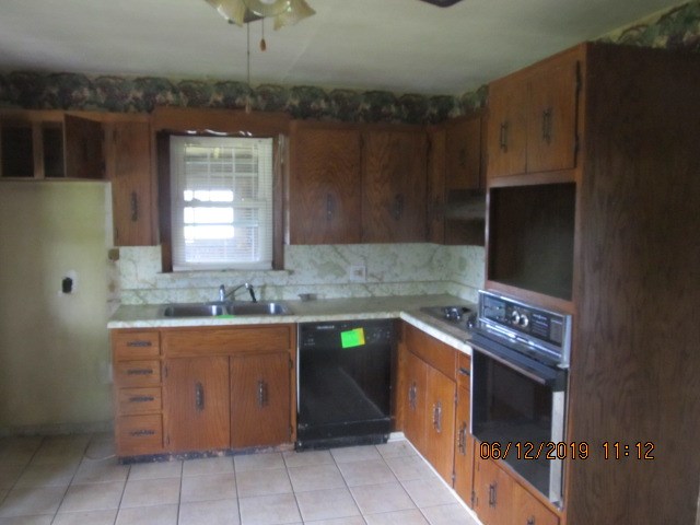 1494 Thompson Road Franklin, PA 16323 - Photo 5 of 21 a kitchen that has a sink and a stove in it