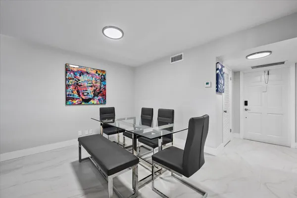 a view of a workspace with furniture and lounge chair