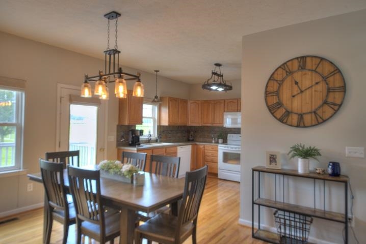 119 Purple Cow Road Waynesboro, VA 22980 - Photo 8 of 66 a view of a dining room with furniture window and wooden floor