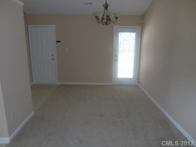 9033 Foggy Meadow Road Charlotte, NC 28269 - Photo 3 of 9 an empty room with a window