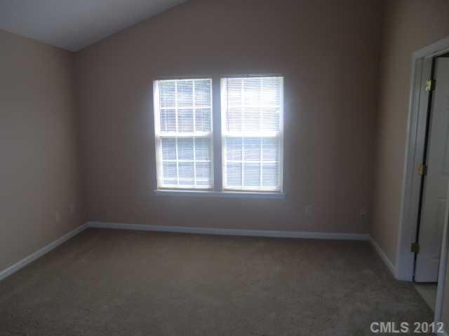 9033 Foggy Meadow Road Charlotte, NC 28269 - Photo 5 of 9 an empty room with a window