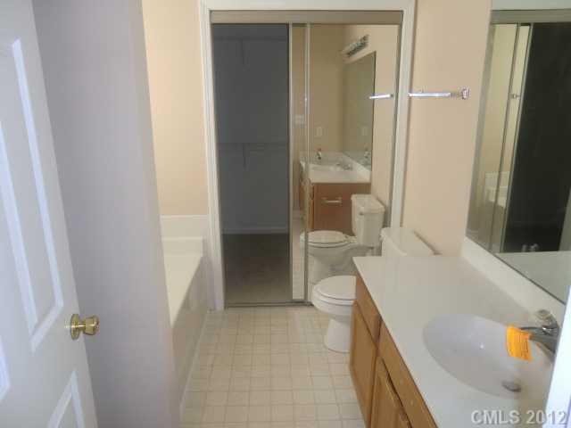 9033 Foggy Meadow Road Charlotte, NC 28269 - Photo 6 of 9 a bathroom with a sink and a toilet