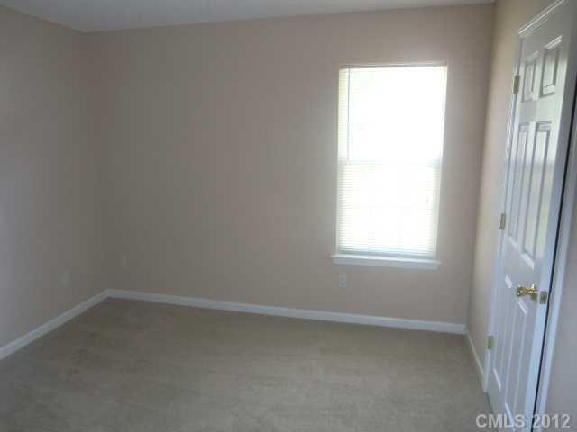 9033 Foggy Meadow Road Charlotte, NC 28269 - Photo 8 of 9 an empty room with a window