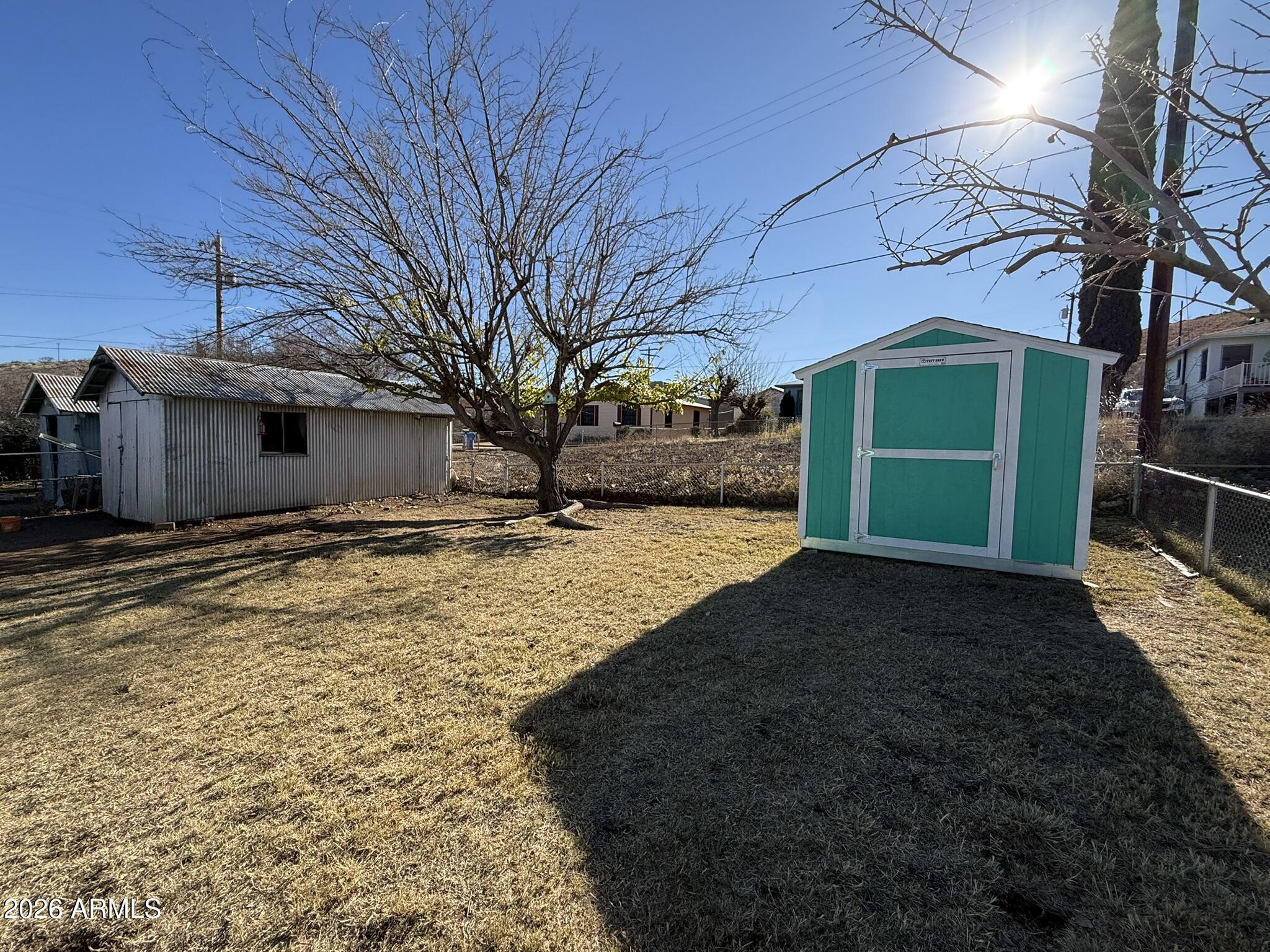 91 Neptune Avenue Bisbee, AZ 85603 - Photo 11 of 12 a view of a house with a yard