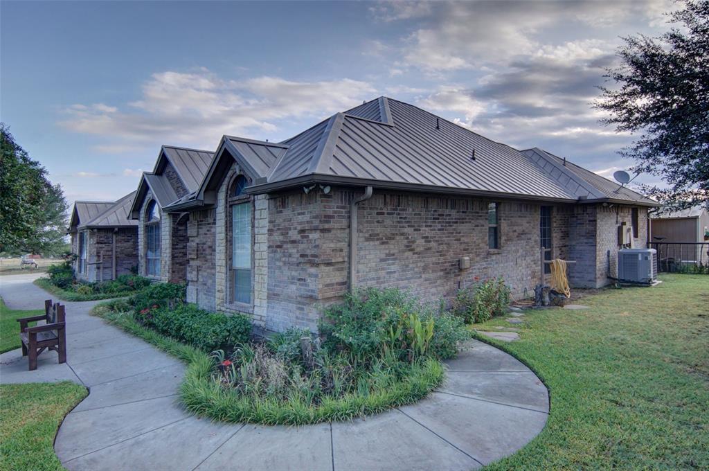 272 Edward Farris Road Weatherford, TX 76085 - Photo 4 of 40 Brick exterior with stone accents and arched windows