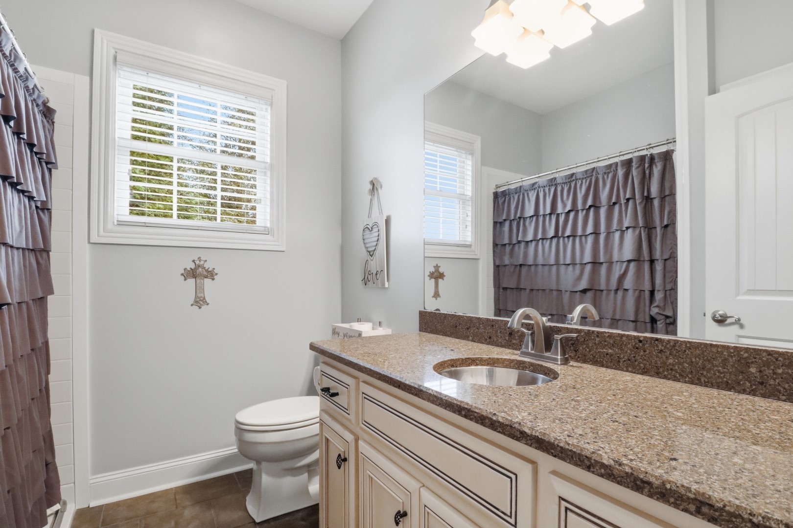 3287 Bluebird Road Lebanon, TN 37087 - Photo 25 of 59 a bathroom with a granite countertop sink toilet and mirror