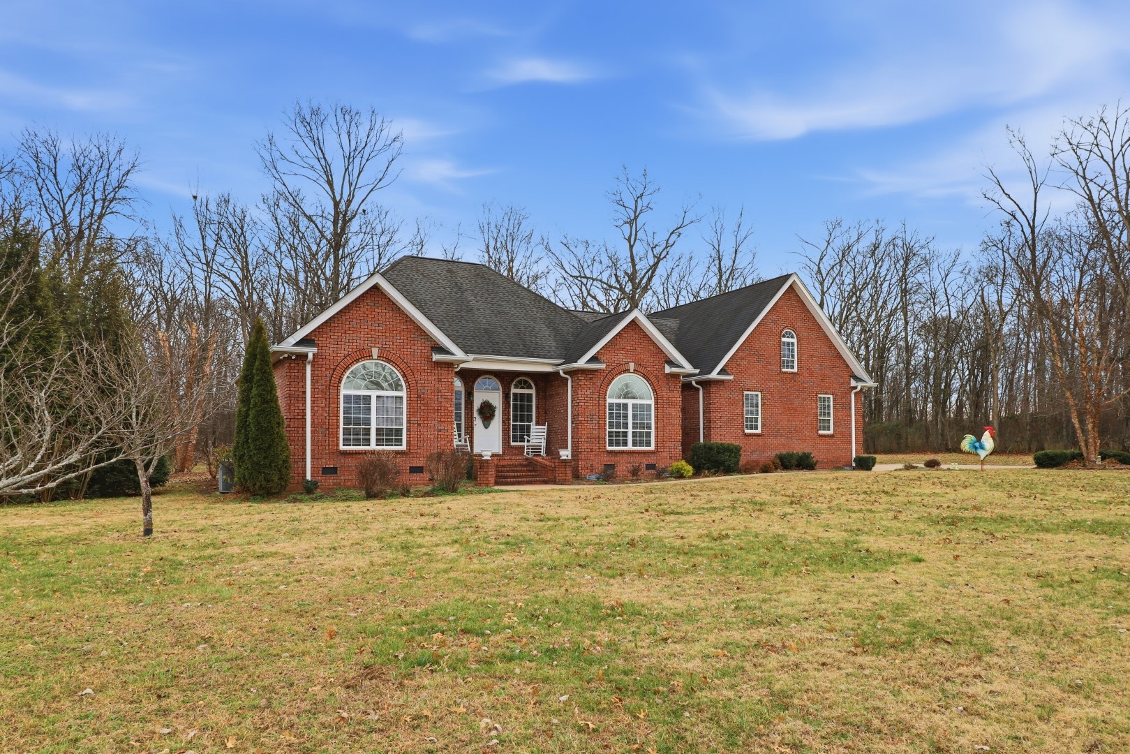 3287 Bluebird Road Lebanon, TN 37087 - Photo 3 of 59 a front view of a house with a yard and trees