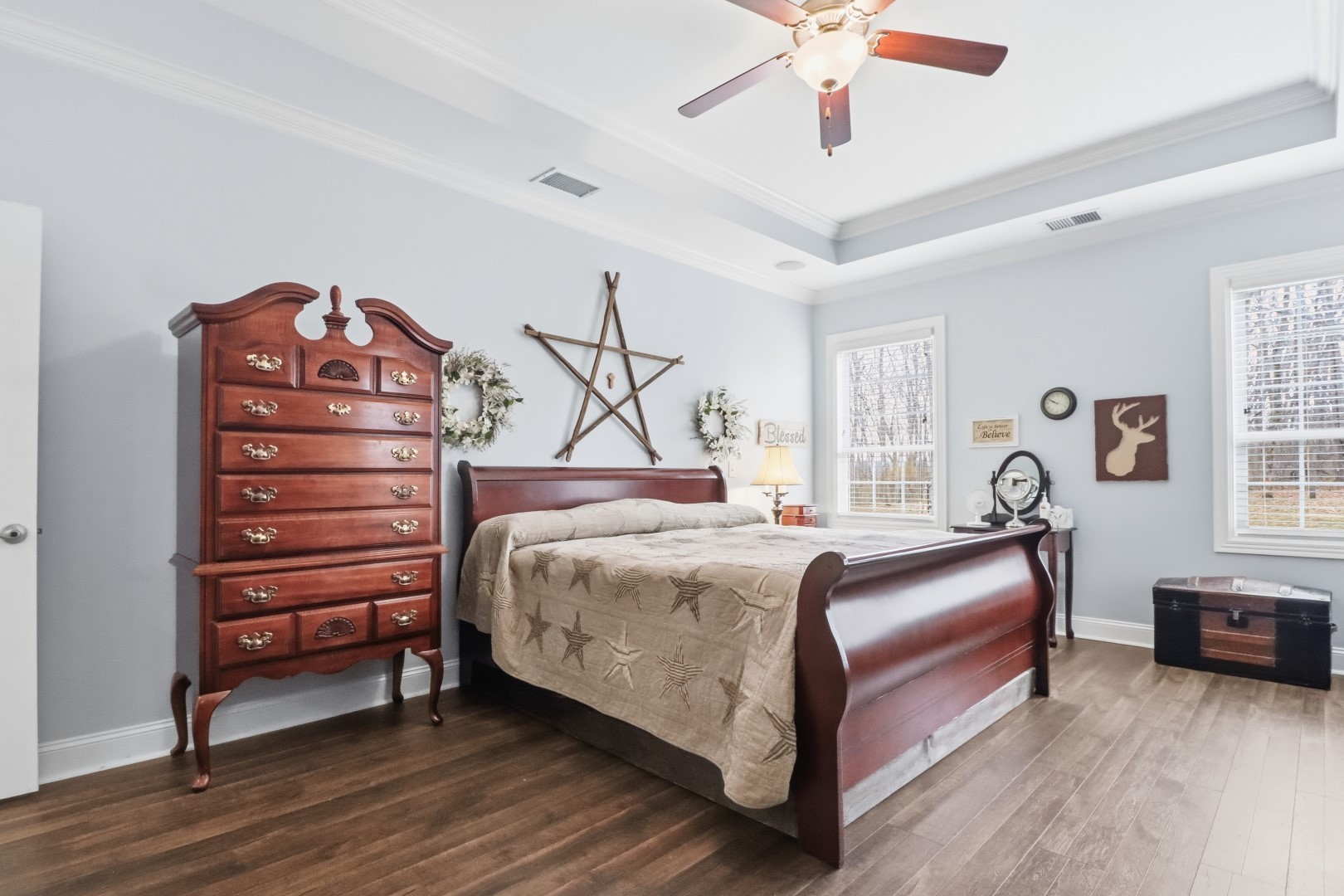 3287 Bluebird Road Lebanon, TN 37087 - Photo 34 of 59 a bedroom with a bed and a chandelier