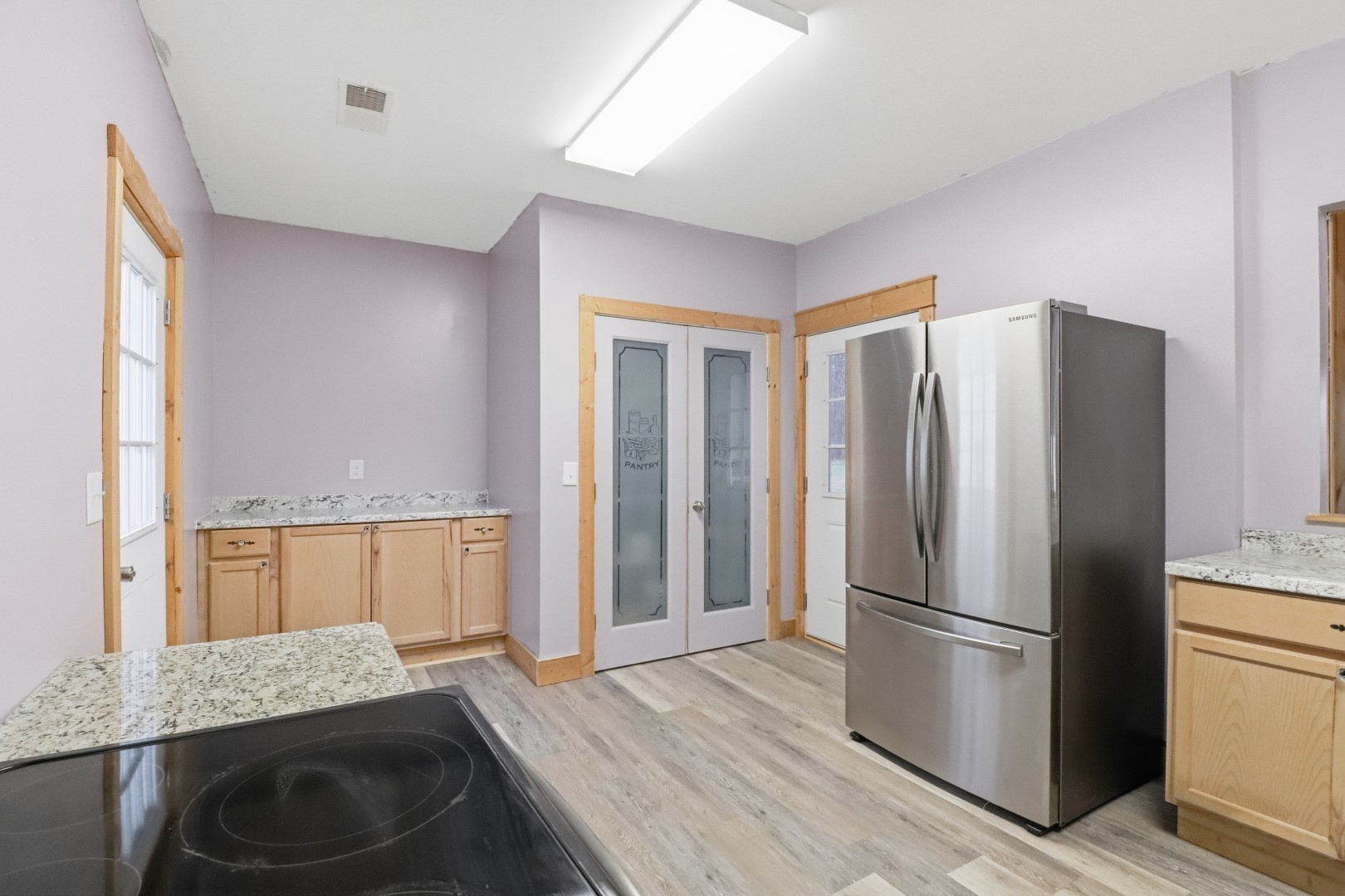 3287 Bluebird Road Lebanon, TN 37087 - Photo 47 of 59 a kitchen with granite countertop a refrigerator and a sink