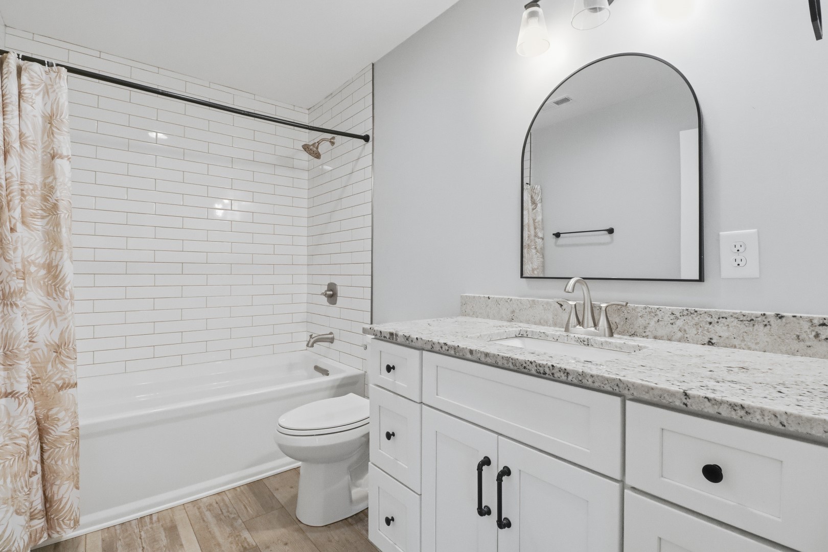 3287 Bluebird Road Lebanon, TN 37087 - Photo 53 of 59 a bathroom with a granite countertop sink a toilet and a bathtub
