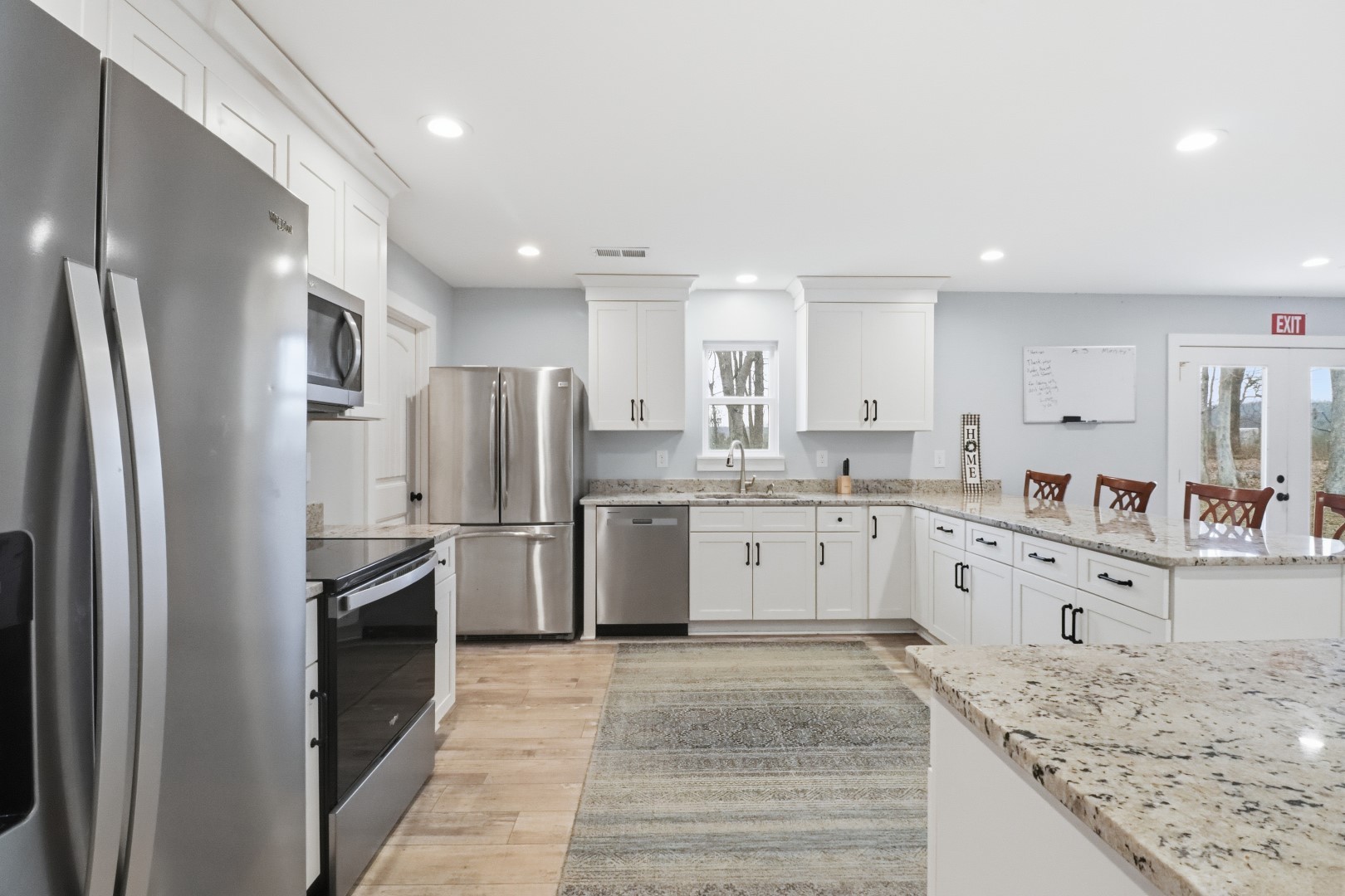 3287 Bluebird Road Lebanon, TN 37087 - Photo 57 of 59 a large kitchen with granite countertop a large counter top stainless steel appliances and cabinets