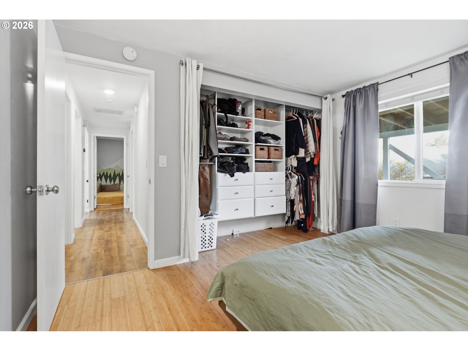 19350 Southwest Murphy Street Beaverton, OR 97078 - Photo 14 of 45 a view of a bedroom with wooden floor and windows