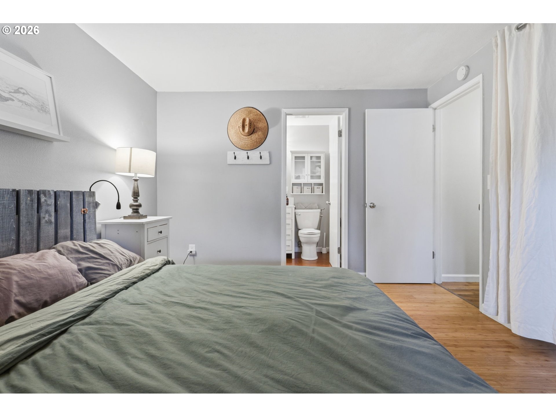 19350 Southwest Murphy Street Beaverton, OR 97078 - Photo 15 of 45 a bedroom with a bed and a lamp