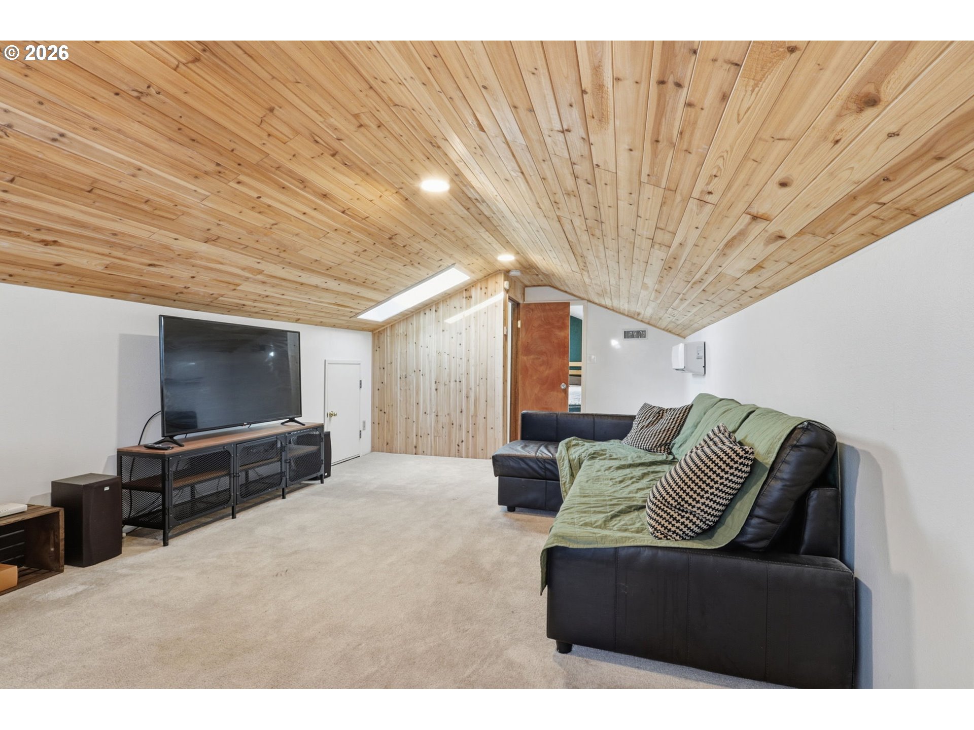 19350 Southwest Murphy Street Beaverton, OR 97078 - Photo 23 of 45 a living room with furniture and a flat screen tv