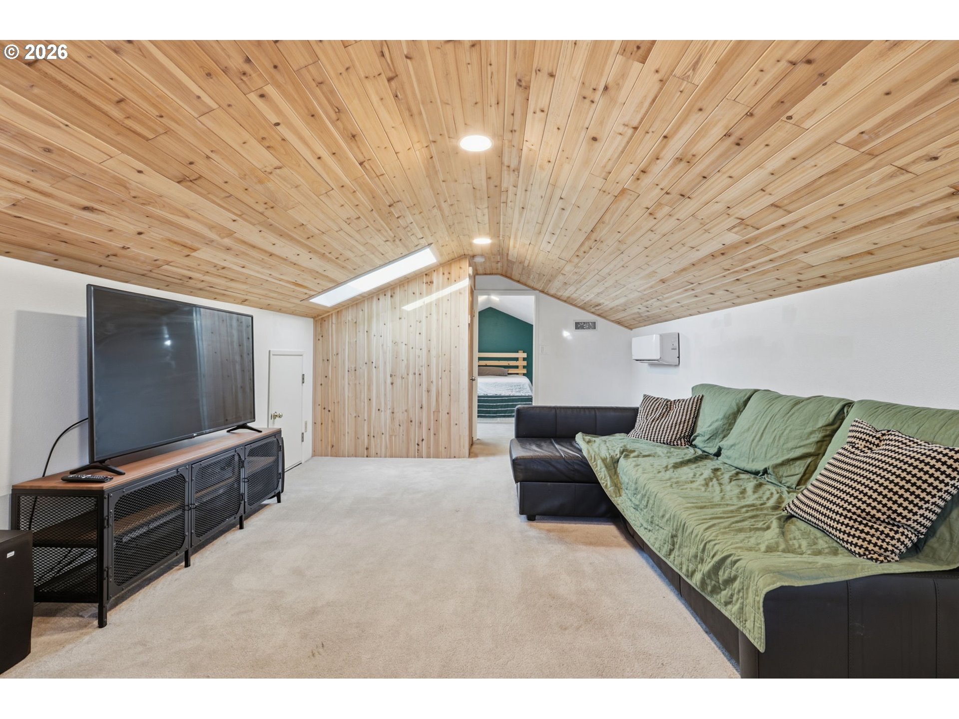 19350 Southwest Murphy Street Beaverton, OR 97078 - Photo 24 of 45 a living room with furniture and a flat screen tv