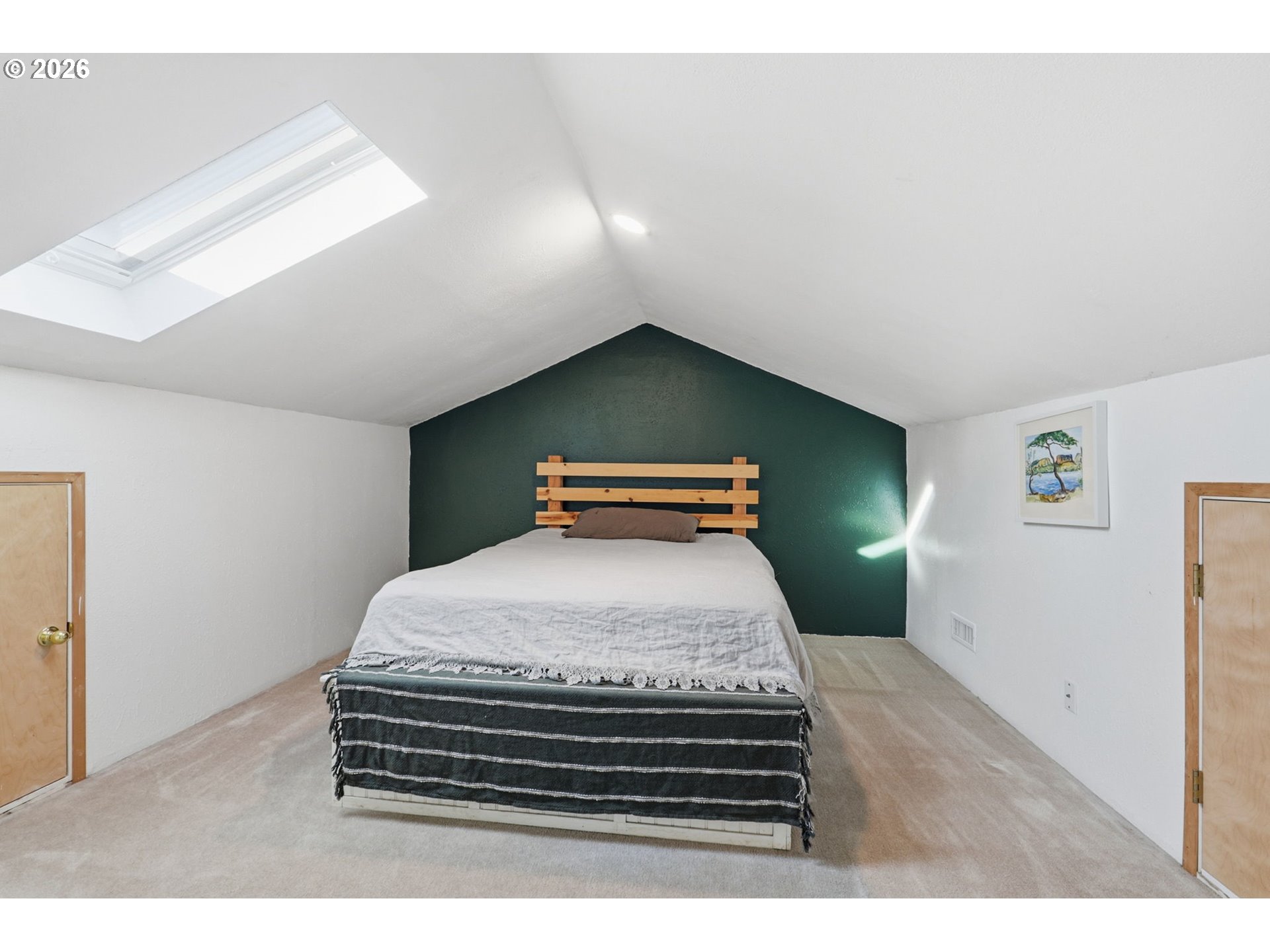 19350 Southwest Murphy Street Beaverton, OR 97078 - Photo 25 of 45 a bedroom with a bed and a chandelier