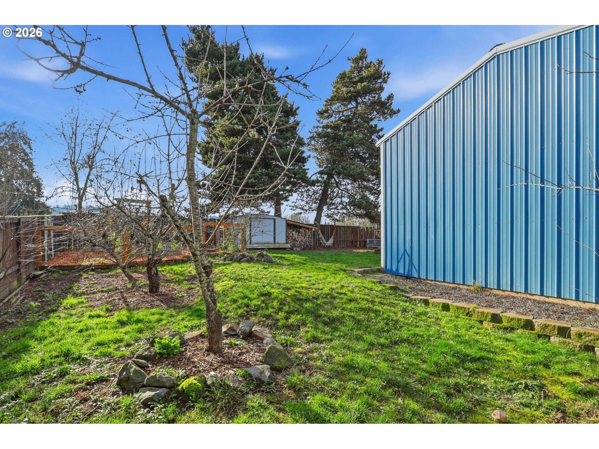 19350 Southwest Murphy Street Beaverton, OR 97078 - Photo 27 of 45 a view of a backyard with a large tree