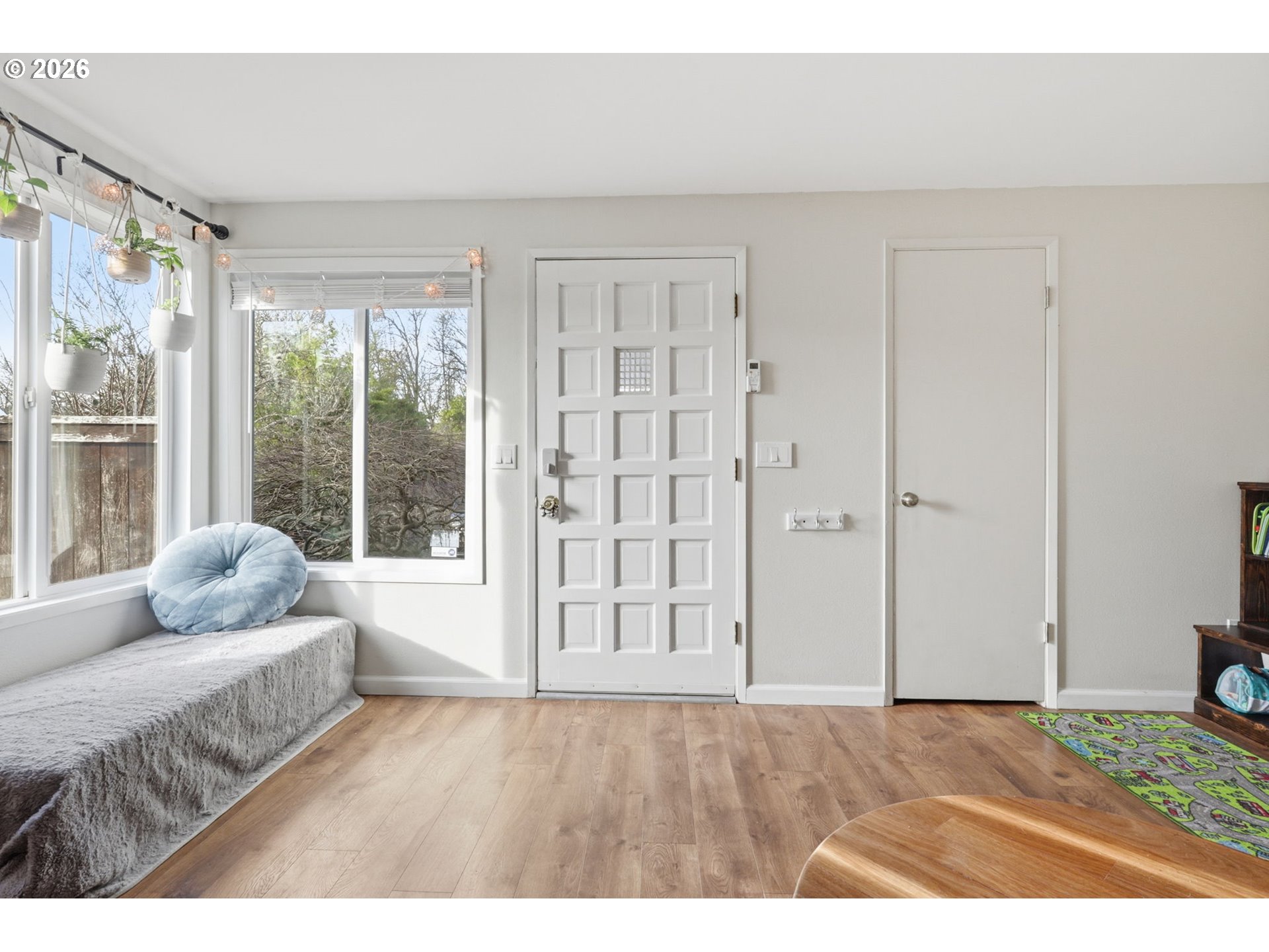 19350 Southwest Murphy Street Beaverton, OR 97078 - Photo 3 of 45 a living room with furniture and a floor to ceiling window