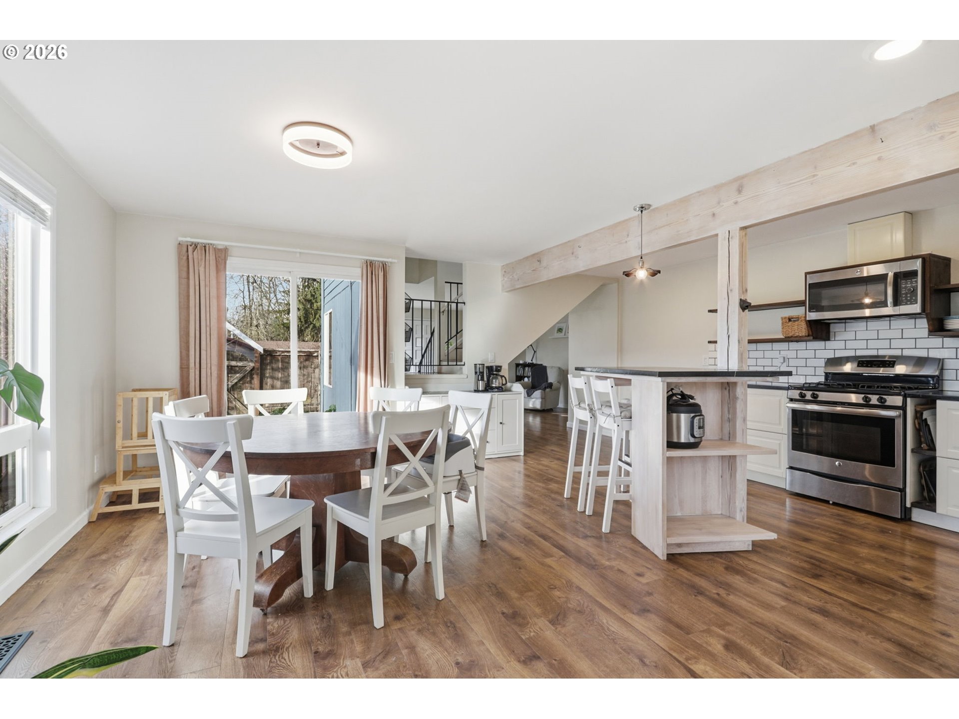 19350 Southwest Murphy Street Beaverton, OR 97078 - Photo 10 of 45 a dining room with furniture and wooden floor